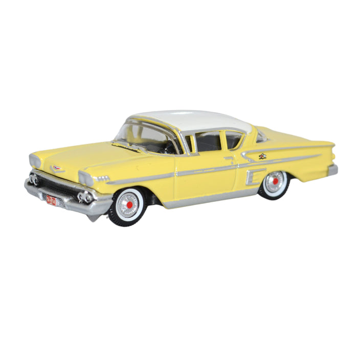 Model of the Colonial Cream/Snowcrest White Chevrolet Impala Sport Coupe 1958 by Oxford at 1:87 scale.